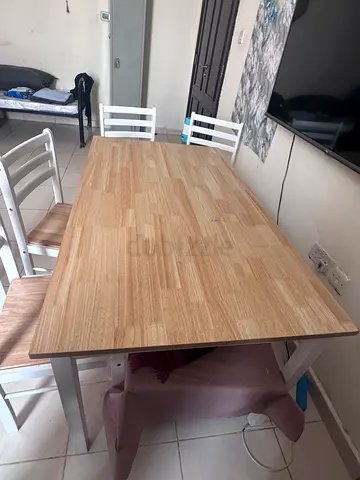 Solid wood-top dining table with 6 chairs - good condition
