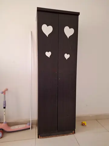 Tall dark wooden shoe cabinet with heart decals - good condition