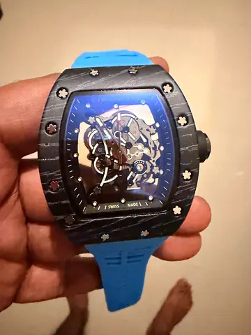 Skeleton dial mens watch with blue rubber strap