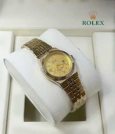 Rolex gold-tone wristwatch with patterned dial — good condition