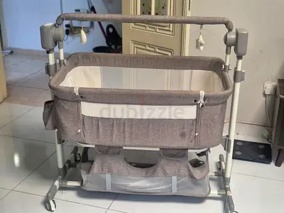 Gray Adjustable Baby Bassinet with Storage and Wheels