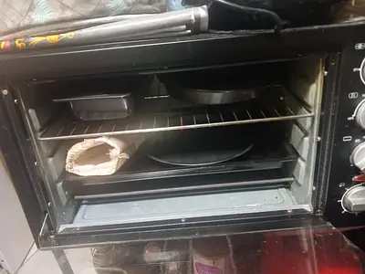 Used electric oven with baking trays