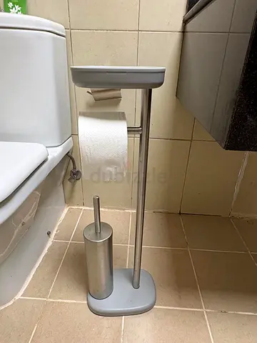 Bathroom tissue holder with commode brush and phone storage