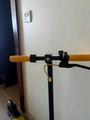 Used electric scooter — sturdy kickstand, good condition Comes with charger