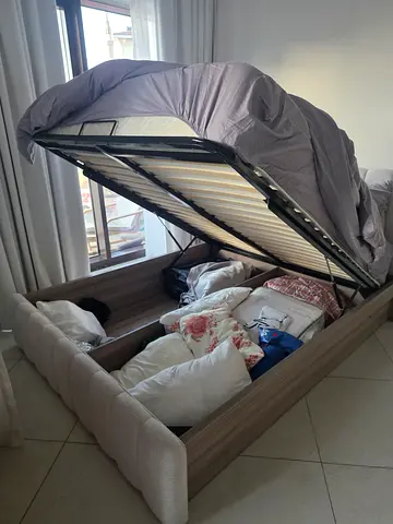 Queen storage lift-up bed frame with upholstered headboard from home center bought for 5500 aed