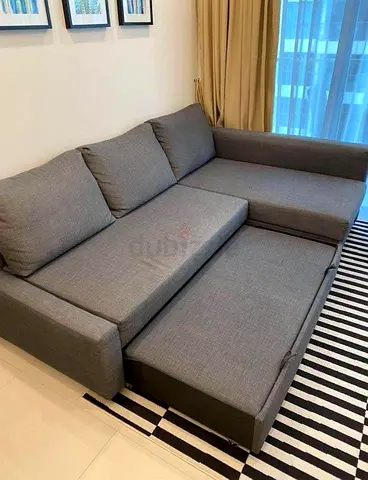 Grey L-shaped Sofa with Pull-out Bed — Good Condition