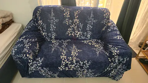 Two-seater blue patterned sofa - good condition