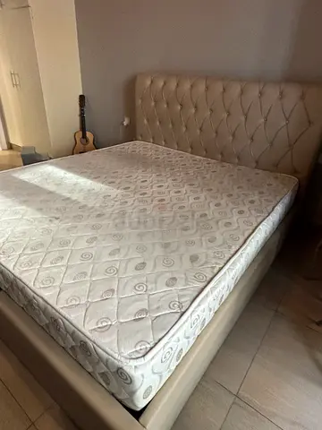 Queen bed frame with mattress and padded headboard - good condition