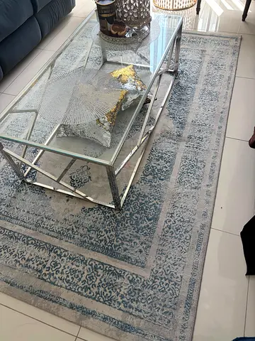 Light blue vintage-style rug in excellent condition