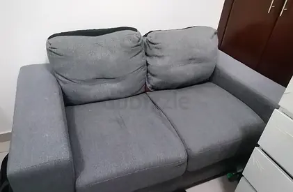 2-Seater Grey Fabric Sofa — Good Condition