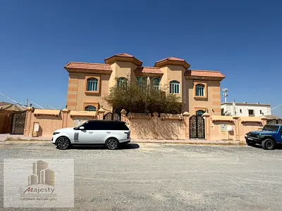 Two villas for sale on one plot of land in Al Yash area