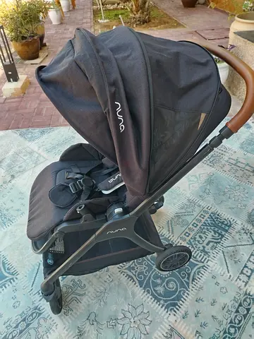 Nuna TRIV Next stroller in the Caviar colorway.