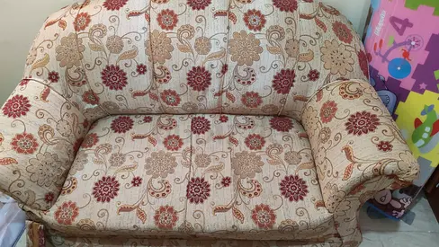 Urgent-Two-seater (3Nos) patterned fabric sofa — in good condition with visible wear and tear.