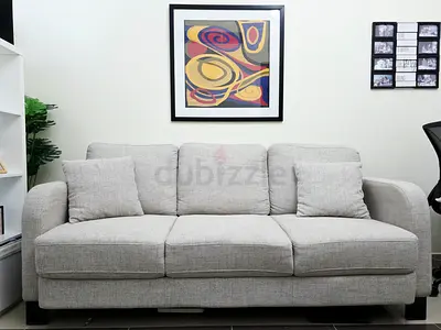 Light grey 3-seater fabric sofa in good condition