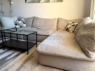Light grey L-shaped fabric sofa with chaise - good condition