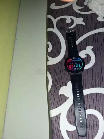 Used black round smart watch with heart rate tracking - good condition