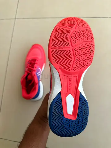 Used pair of red/blue indoor court sports shoes — good condition. EU size 36