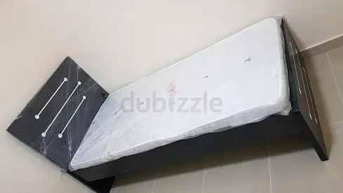 Single wooden bed frame with new mattress