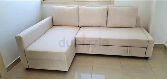 Light Beige L-shaped Sofa Bed with Storage - Good Condition