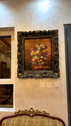 Framed vintage floral oil painting with ornate gilt frame
