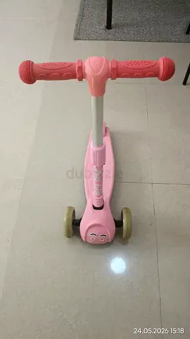 Lightly used pink three-wheel kids scooter — adjustable handle, stable for toddlers