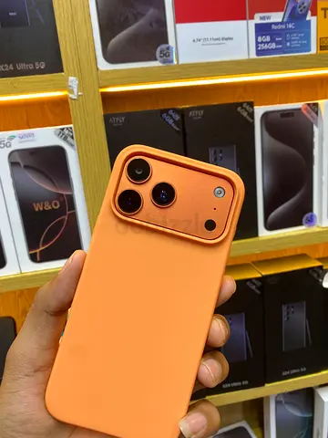 Good condition smartphone with triple rear cameras — orange case included