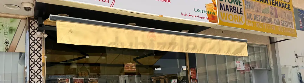 Retractable Storefront Awning — Beige, Good Working Condition