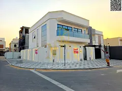 Corner villa for sale in Al Bahia, two floors and a roof, price including registration fees