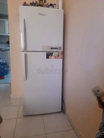 White two-door fridge/freezer in good working condition