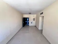 A spacious apartment located in Al Rawda 1, behind Al Hamidiya Police Station, near Kanz Mall,