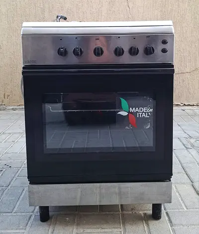 This Gas Cooker, working perfectly,  brand Bompani,  size 60x60cm with 4 burners, neatclean