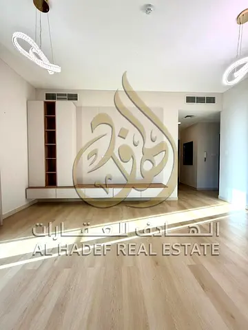 2BR apartment in Al Zahia with large balcony & equipped kitchen, wardrobes, wooden flooring, pool & parking, premium community.