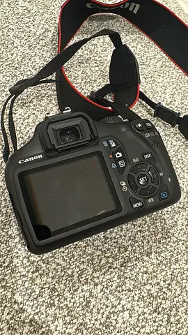 Canon DSLR body with strap - used, good condition