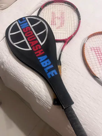 Squash tennis  racket and cover set - used, good condition . Each one 50 dhs