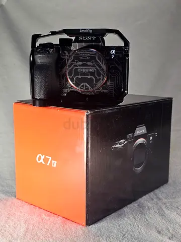 Sony Alpha 7 IV (a7 IV) Mirrorless Camera Body with Original Box, Wrapped and with Small Rig cage.