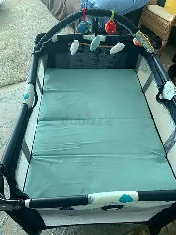 Used Baby Playpen / Portable Playard with Mattress and Hanging Toys
