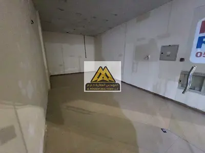 A great opportunity to rent a spacious commercial shop in Al Mowaihat 3, Ajman, located directly on the main road
