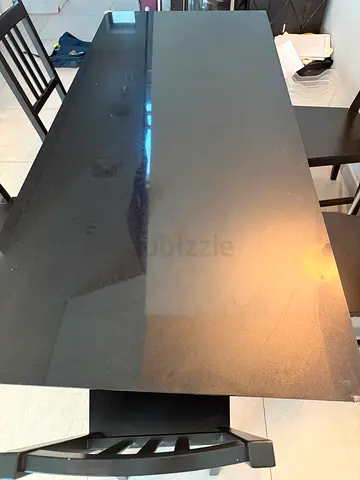 (AED 150 today only) Heavy, solid marbel dining table and 5 Solid black wooden CHAIRS