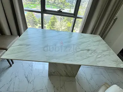 Elegant KARE Design Marble dining table, seats up to 6 people.