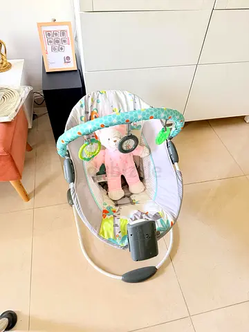 Baby bouncer rocker with toy bar - gently used