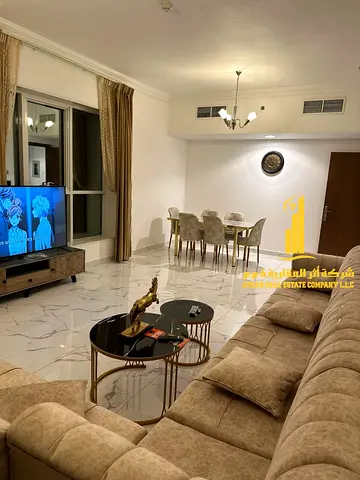 Luxurious two-bedroom apartment with a balcony, newly furnished, for monthly rent in Ajman - Al Rashidiya 1 - Al Waha Towers