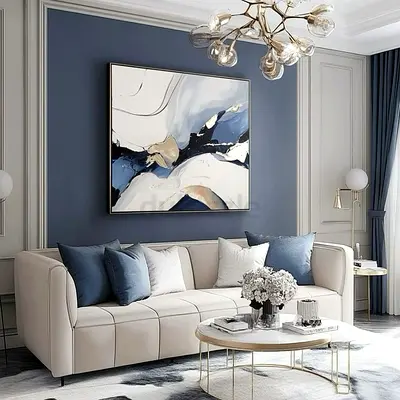 Modern Cream Fabric Sofa with Blue Throw Pillows