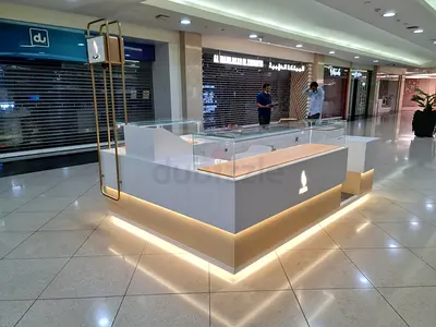 Mall kiosk counter/island with glass display and LED lighting