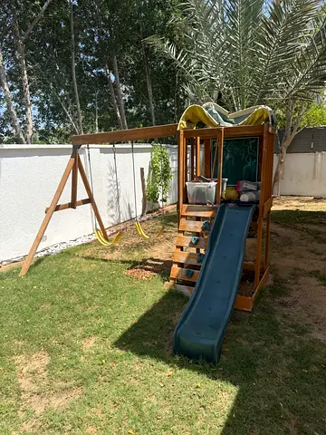 Wooden outdoor kids playset with slide and swings - good condition