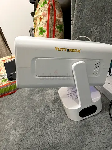 Brand new smart projector. With Bluetooth speaker. 1080p. Auto focus. Only 15 days old. With Remote