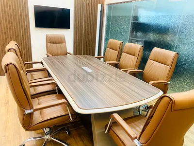 Conference table with 8 brown leather swivel chairs - Excellent condition. Never Used