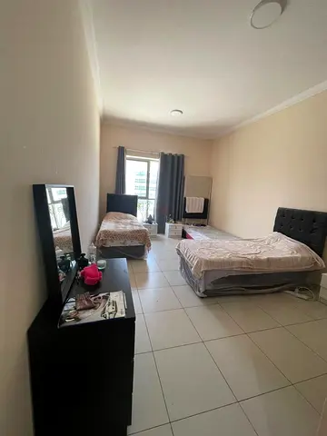 Beautiful bed space with two ladies in master room in front of mall of emirates For ladies only