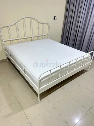 Almost new IKEA king bed with mattress 180cm x 200cm. Pick up from khalifa city