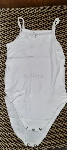 White cotton baby onesie singlet with snap buttons — size small ( there are 12 pieces available)
