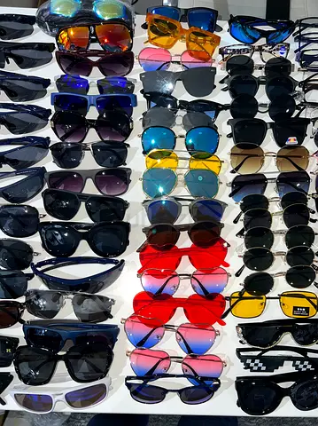 Collection of mixed sunglasses — assorted styles and colors